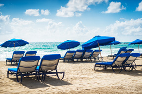 picture of lounge chairs on a beach